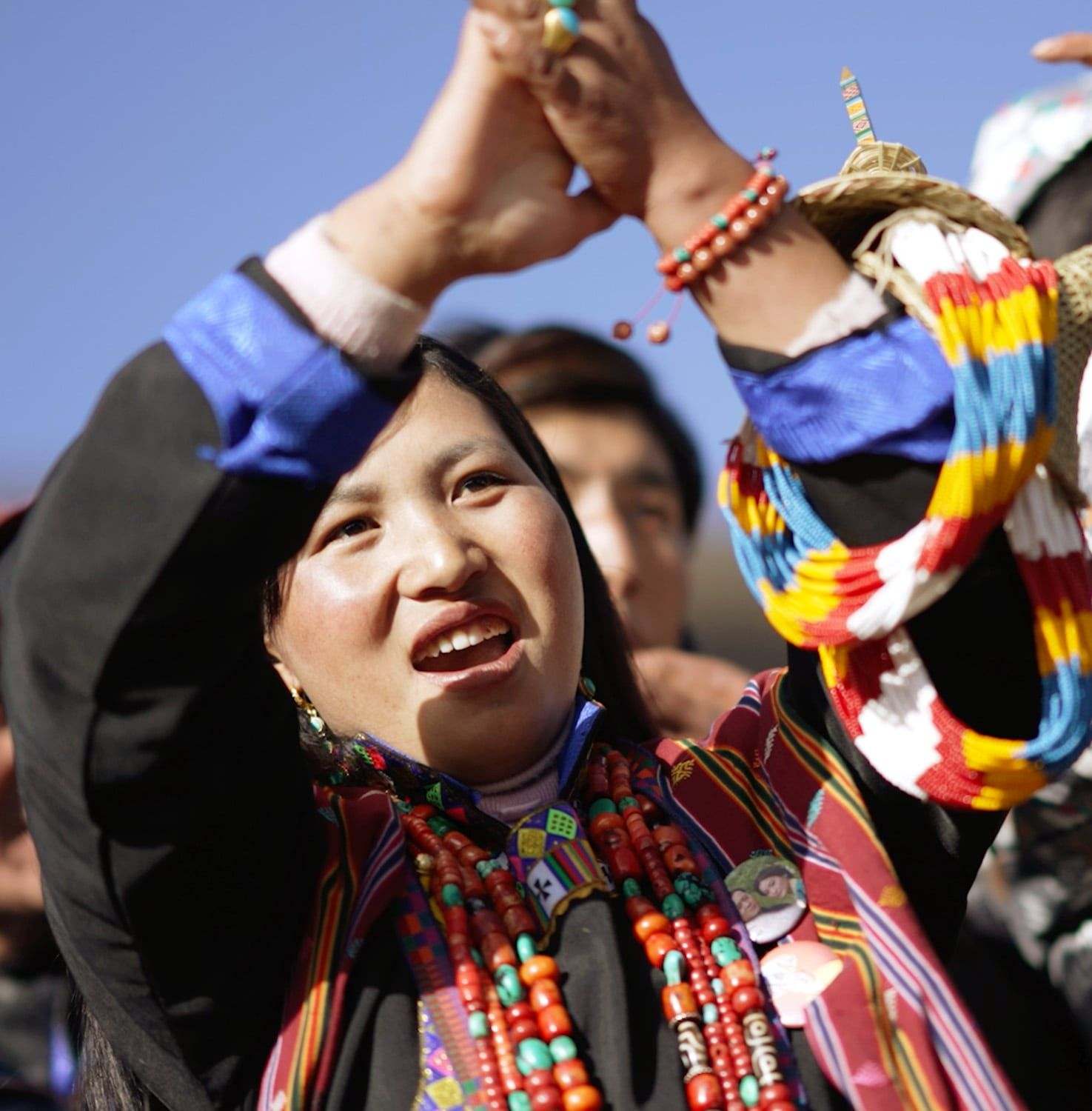 A woman of Laya in traditional dress and conical bamboo headdress at the Royal Highland Festival, Bhutan