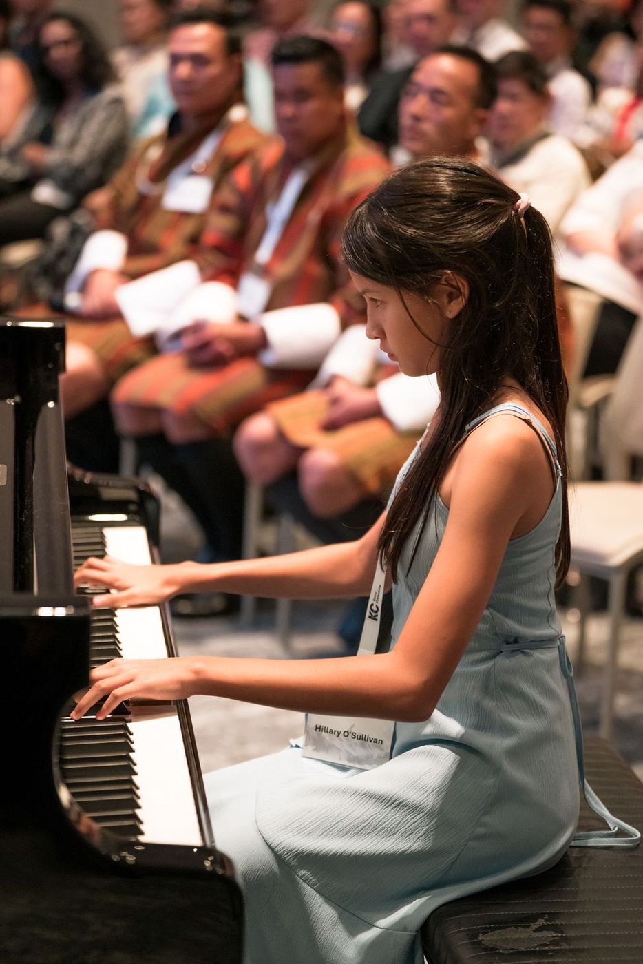 Hillary O’Sullivan playing the piano to the room after the Singapore premiere screening